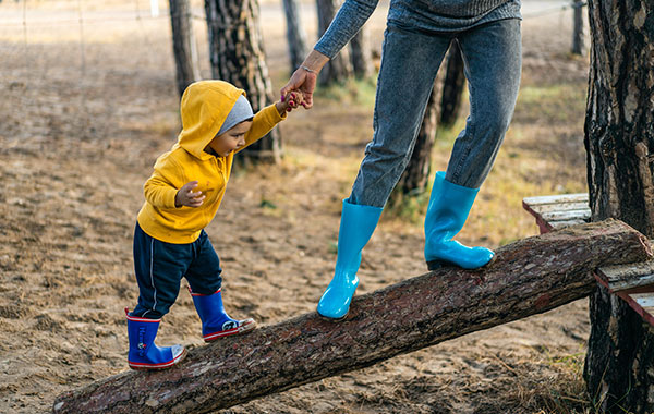 child holding parents hand